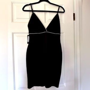 Brand new with tags Lovely Day little black dress with rhinestones. Size medium.